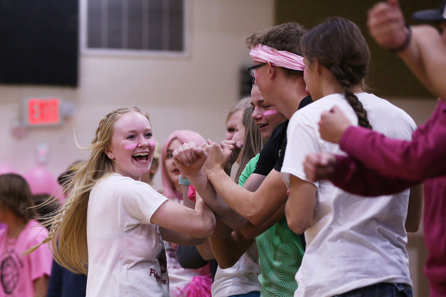 Makayla Moses races up and down the student section in celebration
